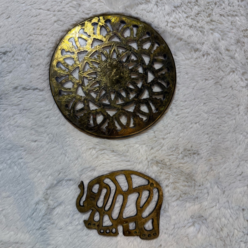 2~Vintage brass trivets, one round with glass insert & small footed elephant